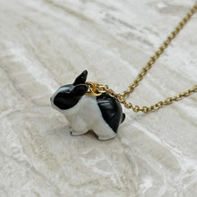 Load image into Gallery viewer, Black and White Bunny Rabbit Porcelain Animal Pendant with Gold Plated Necklace