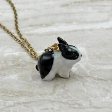 Load image into Gallery viewer, Black and White Bunny Rabbit Porcelain Animal Pendant with Gold Plated Necklace