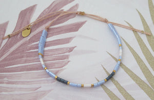 Tila Bead Adjustable Bracelet in Navy Blue, Iridescent Blue, Gold and Iridescent White